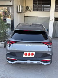 سبورتج ٢٣  هايبرد xl وارد امريكي بدون حادث رقم بغداد ماشيه 44 ميل سيار...