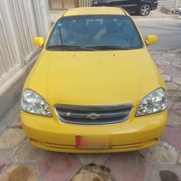 سيارة تاكسي صفراء . فورنزا  اوتوماتيك . رقم دولي حديث . باسمي . كربلاء...