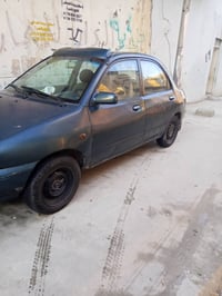 مازدا حجم 121نينوى موديل 1991رقم انكليزي بسمي محرك بدايت نفخ كاربون با...