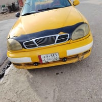 دايو لانوس رقم كركوك سعر  37 وبيها مجال شرط وكاله نقابه مصفر موديل 200...