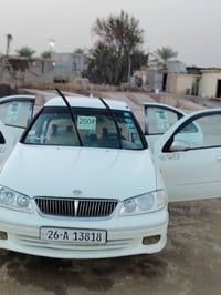 نيسان سني للبيع موديل 2003 گير عادي  كهربائية كل شغاله السياره كلش نضي...