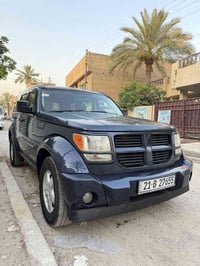 للبيع دوج نترو 2008 مكفوله كير ومكينه تخم تاير جديد غرفه جديده السياره...