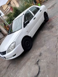 لانسر ٢٠٠٦ • اوتوماتيك • محرك وكير نضيف