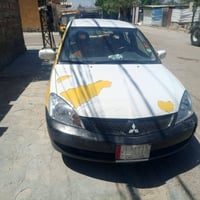 لانسر مسيبوشي  2010بغداد نصيفه كله شغال تبريد شغال لسعر 60بيهه مجال حك...