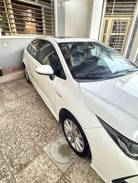 كورلا 2024 هايبرد   ماشيه 40 الف  فول مواصفات 1/1   فتحه   بصمه   سلاي...