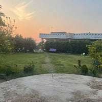 أرض زراعية • ٤ دونم • منزلين