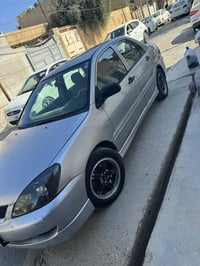 لانسر ٢٠١١ • قطعتين صبغ • رقم اربيل