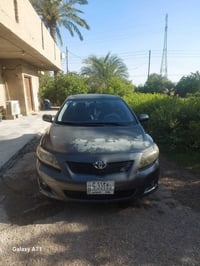 سياره كورلا وارد امريكي 2009 S ضربتها مثل ا موضحه بالصور من امريكا بيه...