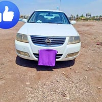 للبيع نيسان سني ٢٠٠٨ قبق اسود  رقم بغداد باسمي مكفولة بدون حادث  تبريد...