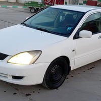 لانسر ٢٠١٠ • رقم كربلاء • مكينة وكير مكفول