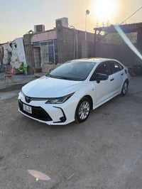 كورلا هايبرد 2025 قطعه وحده باب مراجع عدل بارد ماشيه ١٥ الف 150$ 07822...