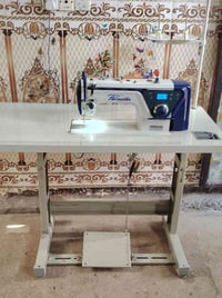 ماكنة خياطة • كاتم