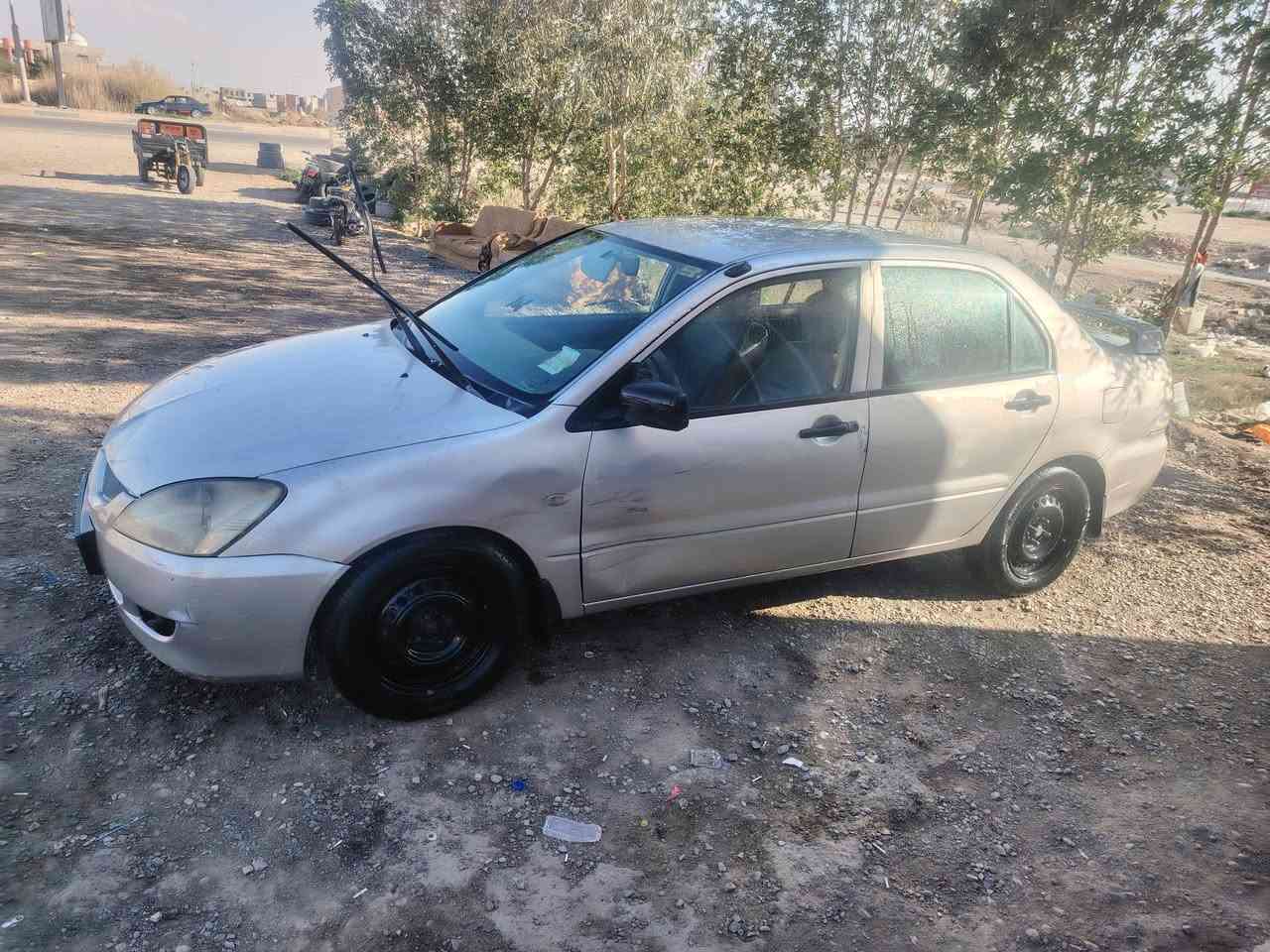 لانسر 2006 جارده باسمي رقم بغداد دولي هزه قبل شهر دخلته  تحويل ثاني يوم بلاديه لاخياس لاضربه فقط دحجة بالباب كهربائيات كله بلاديه بدون اي جطل محرك 1300 اقتصادي جدا تبريد تدفئه كله شغاله بدون اي نقص صدر نص عمر  65 ورقه وبيه مجال بسيط *********** عنوان ديالئ -هبهب
