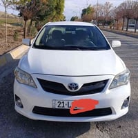 تويوتا كورولا 2009 محرك 1.8 لون أبيض ثلجي الواجهة والأخير معمولين 13 ق...