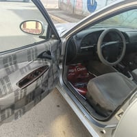 نوبرا ٢٠٠١ السيارة مصبوغة عام ما عدا قبع الجنطه بيه طخه موضحه بالصور ا...