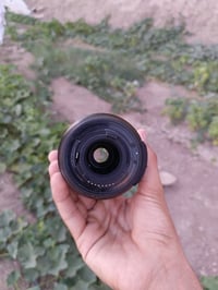 نيكون • ١٠٥/١٫٨ • بابل