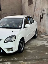 كيا ريو موديل ٢٠١١ ضرر فوك الايت شبر وبارد بين البابين  سياره عليها من...