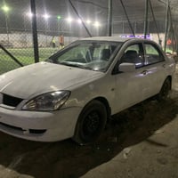 من رخصة الادمن لانسر  2007 رقم صدامي بغداد بااسمي محرك يبخر وبيهه نواق...