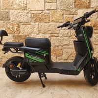 دراجة شحن R11 نضيفة اخو جديد كلشي شغال  كامل ملحقاتها شاحن تحطها بس تق...
