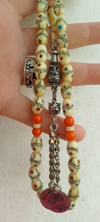 مسبحة عظم • ٣٣حبة • عيون فيروز