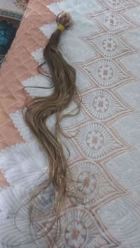 شعر طبيعي • طويل • ٥٠ خصلة