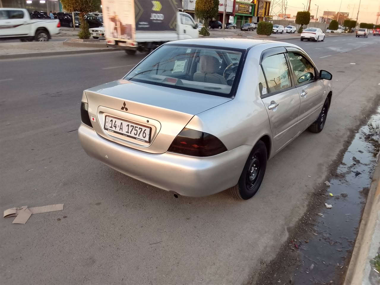 لانسر 2004مصبوغه عام  مكينه تبخر  بكاني بغداد الرقم  ***********موجود واتساب
