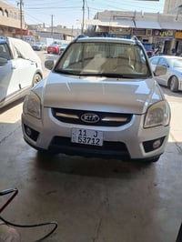 كيا سبورتج ٢٠١٠ خليجي ماشية ١١٢ الف كيلو لون فضي  محرك ٤ سلندر  صبغ صف...