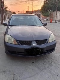 للبيع لانسر موديل 10   رقم قادسيه شرط تحويل  مكينه كير تبريد كله بلادي...