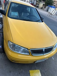 نسان سني لبيع موديل 2000 سياره حلوه كامله من كلشي  مكينه قبغ اسود مضوم...