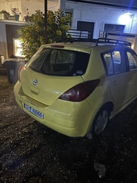 نيسان فيرسا تكسي   رقم بغداد انكليزي 2009  مصفره هيئه وغرامات   باسمي ...