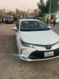 كورلا هايبرد ٢٠٢٥ فول مواصفات ١/١  داخل احمر جلد  كشن كهرباء  بصمة ابو...