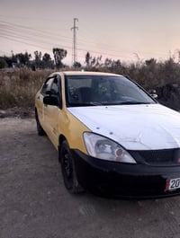 لانسر • ٢٠٠٩ • طخة خلفي