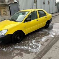 لانسر بومه للبيع 2009  ا ومكينه وتبريد كفاله مكينه 2000 بدون   السياره...