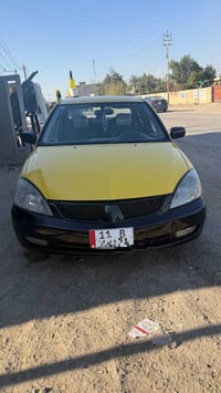 لانسر 2010 بأسمي  محرك 2000  كير عادي  ماشية ٣٥٠.٠٠٠كم تقريباً مصفرة ه...