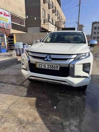 مسيوبيشي بيكب L200 فورل ويل بانزين كير عادي  2023 فول مواصفات  مكفوله ...