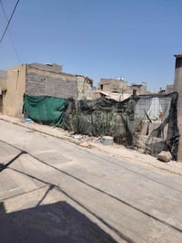 قطعه للبيع مساحه100 بربع نزاله 10×10  في مدينه الصدر مقابل قطاع48 بشار...