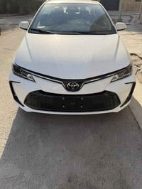 كورلا هايبرد موديل 2025  رقم بغداد مرقمه  المواصفات فتحه وبصمه  وقطعتي...