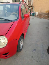 كيو كيوالون احمر سياره جاهزه رقم نكليزي 25وبيها مجال07838727965