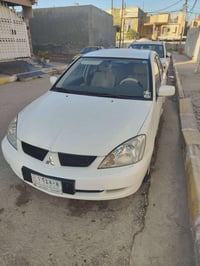 لانسر ٢٠١٠ • ١٥٠٠ اوتوماتيك • كفالة لغاية ٢٠٢٨