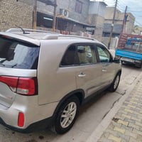 سورنتو وراد أمريكي  لون رمادي موديل 15 رقم بغداد الدولي حادثه من الخلف...