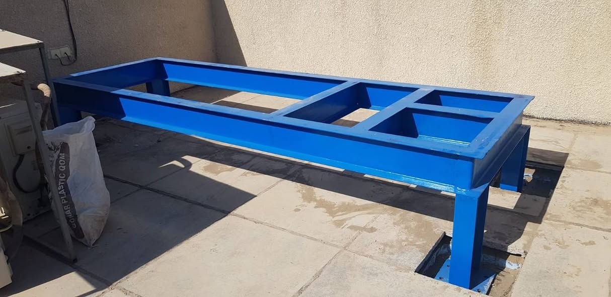 تُنفَّذ القواعد الخاصة بالمولدات الكهربائية وأجهزة التبريد المركزي لغرض تحمّل أوزان المعدات وتوزيع الأحمال بشكل آمن على الأرضية، وضمان تثبيت الأجهزة واستقرارها أثناء التشغيل.
كما تهدف هذه القواعد إلى تقليل الاهتزازات والضوضاء الناتجة عن عمل المعدات ومنع انتقالها إلى الهيكل الإنشائي للمبنى، إضافةً إلى حماية الأجهزة من الرطوبة والمياه من خلال رفعها عن منسوب الأرض.
وتُسهم القواعد أيضاً في تسهيل أعمال التشغيل والصيانة والفحص الدوري، وتحقيق الاستواء والمحاذاة الصحيحة للمعدات، مما يؤدي إلى إطالة العمر التشغيلي للأجهزة وضمان كفاءة وأمان التشغيل.
فولاذ ستيل
نُقدّم في فولاذ ستيل حلولًا متكاملة في تصنيع وتركيب الأعمال الحديدية وفق أعلى معايير الجودة والدقة، وبما يلبي متطلبات المشاريع السكنية، التجارية، والصناعية.
🔧 خدماتنا
تصنيع وتركيب الهياكل
والمنشآت الحديدية
السلالم، الدرابزين، والمظلات
الشاصيات والقواعد الخاصة
أعمال القص، اللحام، والتجميع الاحترافي
⭐ لماذا فولاذ ستيل؟
مواد عالية الجودة
دقة في التنفيذ
التزام بالمواصفات الهندسية
تسليم ضمن الوقت المحدد
خبرة عملية وكفاءة فنية
🏗️ رؤيتنا
أن نكون الخيار الأول في مجال الأعمال الحديدية من خلال الجودة، المصداقية، والالتزام.
للاستفسار والتواصل:
[٠٧٥٠٠٠٧٤٦٠/***********]
[Steel.foulath@gmail.com]
[الفرع الاول/بغداد كسرة وعطش الصناعية]
[الفرع الثاني/الصقلاوية الخط السريع مفرق سامراء]
