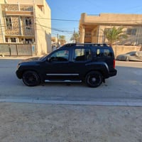 نيسان اكستيرا رقم بغداد  قطعتين صبغ فقط چاملغ أيسر مع بنيد، گير ومكينة...