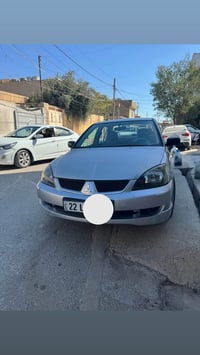 لانسر ٢٠١١ • محدثة سبورت • قطعتين صبغ