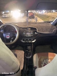 كيا ريو موديل 2012رقم دولي مصبوغه عام أثر جراد مكينه وكير نعمه من الله...