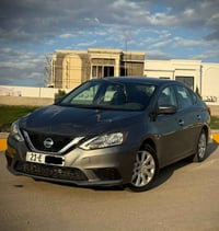 نیسان سێنترا 2017 مواسەفاتی sv  دوو دەراگای بەسمە و سێ مۆدی لێخووڕین (...