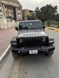 جيب رانكلر 4Xe 2023  لون مميز سمنتي السعر 30500 بچم كبس سياره جدا نضيف...