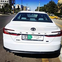 كامري 2025 هايبرد رقم بغداد  وارد أمريكي ماشية 30 الف السعر ٢٣٠ 077215...