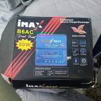 شاحن بطاريات • بطاريات جديدة • كارتونة تعبانة