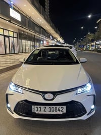 كورلا 2025  شكل الخليجي محرك 1800 هايبرد HEV  داخل جلد اسود رقم بغداد ...