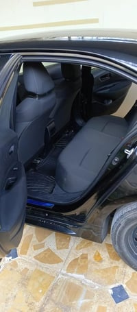 سياره تويوتا كورلا 2022 لون اسود  ماشيه 60 الف كم  تحكمات كامله رادار ...